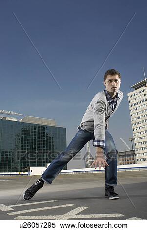 Man dancing on urban rooftop View Large Photo Image Stock Photography - Man dancing on urban rooftop. Fotosearch
