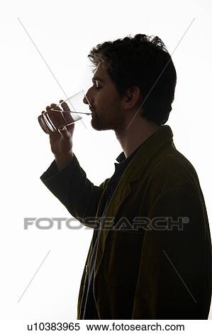 Stock Photography - Man drinking glass of water. Fotosearch