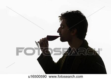 Stock Image - Man drinking glass of wine. Fotosearch