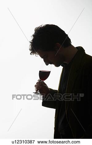 Man drinking glass of wine View Large Photo Image Stock Photo - Man drinking glass of wine. Fotosearch