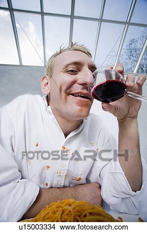 Man drinking wine at dinner View Large Photo Image Picture - Man drinking wine at dinner. Fotosearch
