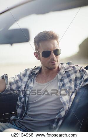 Man driving convertible View Large Photo Image Stock Photograph - Man driving convertible. Fotosearch