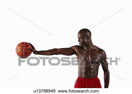 Man holding basketball View Large Photo Image Stock Photo - Man holding basketball. Fotosearch