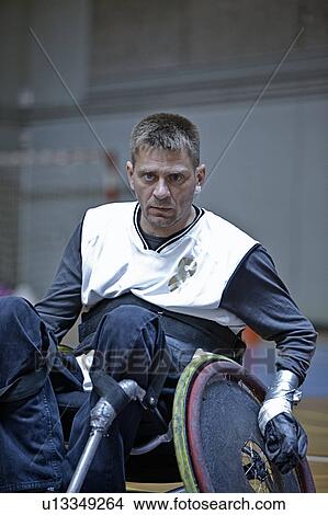 Man in wheelchair playing indoor sports View Large Photo Image Picture - Man in wheelchair playing indoor sports. Fotosearch