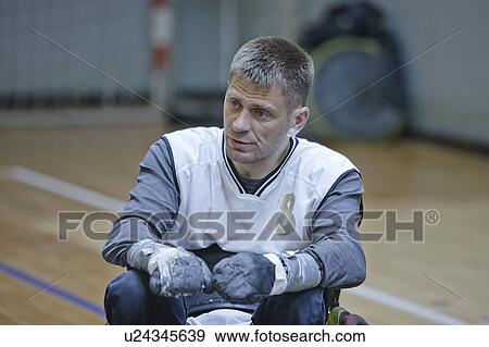Man in wheelchair playing indoor sports View Large Photo Image Stock Photo - Man in wheelchair playing indoor sports. Fotosearch