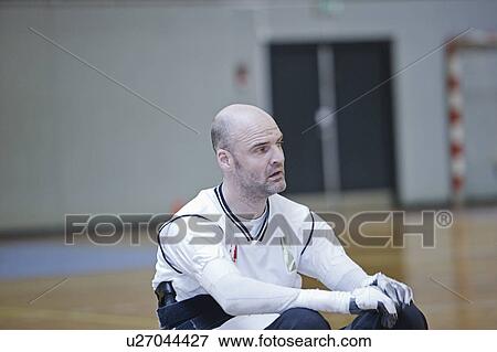 Man in wheelchair playing indoor sports View Large Photo Image Stock Photo - Man in wheelchair playing indoor sports. Fotosearch
