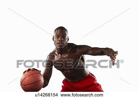 Picture - Man playing basketball. Fotosearch