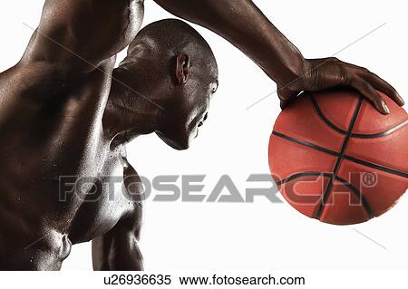 Stock Photography - Man playing basketball. Fotosearch