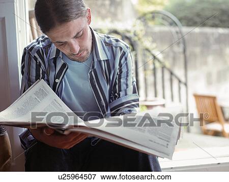 Man reading newspaper View Large Photo Image Stock Photo - Man reading newspaper. Fotosearch