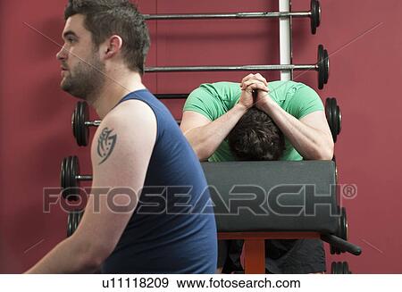 Man resting in gym View Large Photo Image Stock Photo - Man resting in gym. Fotosearch
