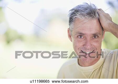 Man smiling outdoors View Large Photo Image Stock Photography - Man smiling outdoors. Fotosearch