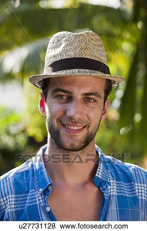Man wearing straw hat outdoors View Large Photo Image Stock Photo - Man wearing straw hat outdoors. Fotosearch