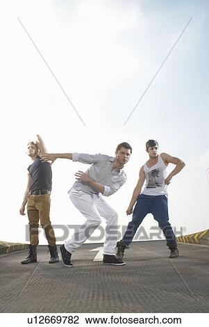 Men dancing in road View Large Photo Image Stock Image - Men dancing in road. Fotosearch