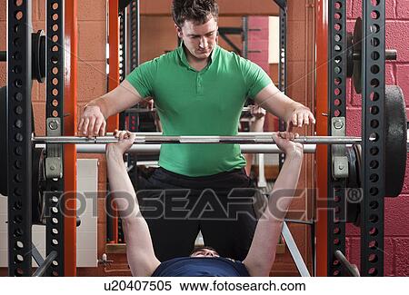 Men lifting weights in gym View Large Photo Image Stock Photography - Men lifting weights in gym. Fotosearch