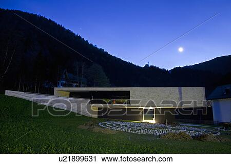 Stock Image - Modern building in rural valley. Fotosearch