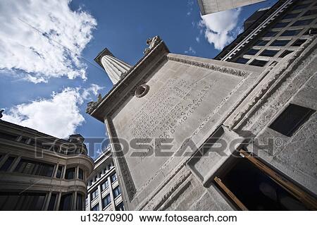 Monument on city street against blue sky View Large Photo Image Stock Image - Monument on city street against blue sky. Fotosearch