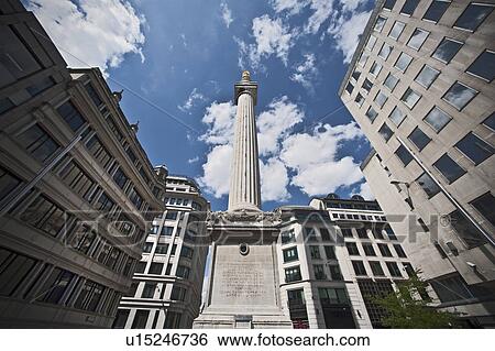 Stock Photograph - Monument on city street against blue sky. Fotosearch