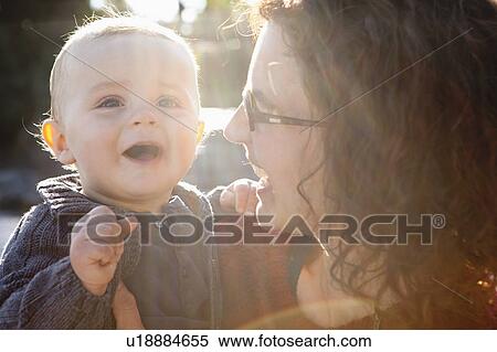 Mother and baby laughing together View Large Photo Image Stock Photography - Mother and baby laughing together. Fotosearch