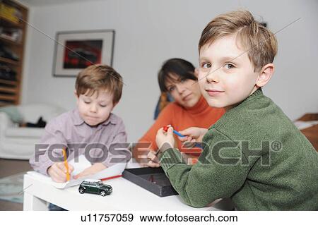 Stock Photo - Mother and children drawing together. Fotosearch
