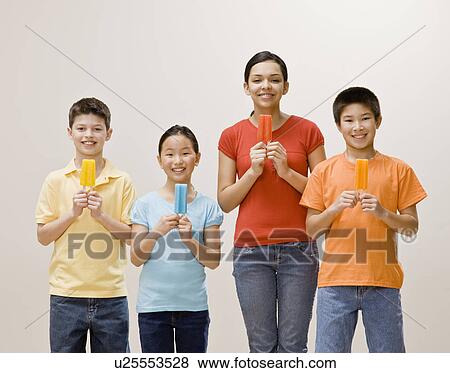 Mother and children holding popsicles View Large Photo Image Stock Photo - Mother and children holding popsicles. Fotosearch
