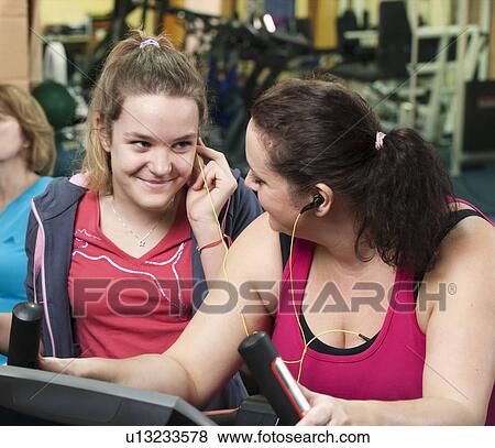 Mother and daughter exercising in gym View Large Photo Image Stock Photo - Mother and daughter exercising in gym. Fotosearch