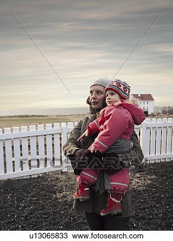 Mother and daughter in backyard View Large Photo Image Stock Image - Mother and daughter in backyard. Fotosearch