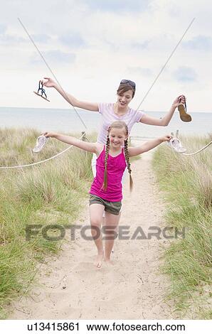 Mother and daughter in bare feet View Large Photo Image Stock Image - Mother and daughter in bare feet. Fotosearch