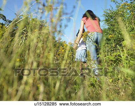 Mother and daughter in field of flowers View Large Photo Image Stock Photography - Mother and daughter in field of flowers. Fotosearch