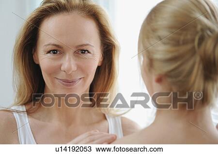 Mother and daughter standing together View Large Photo Image Stock Image - Mother and daughter standing together. Fotosearch
