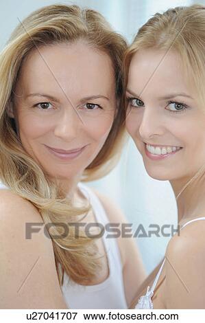Mother and daughter standing together View Large Photo Image Stock Photo - Mother and daughter standing together. Fotosearch