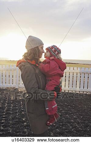 Stock Photo - Mother and daughter touching noses. Fotosearch
