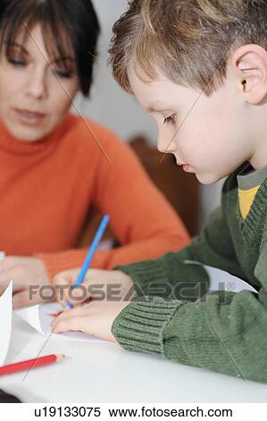 Mother and son drawing together View Large Photo Image Stock Photography - Mother and son drawing together. Fotosearch