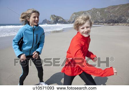 Mother and son playing on beach View Large Photo Image Stock Image - Mother and son playing on beach. Fotosearch