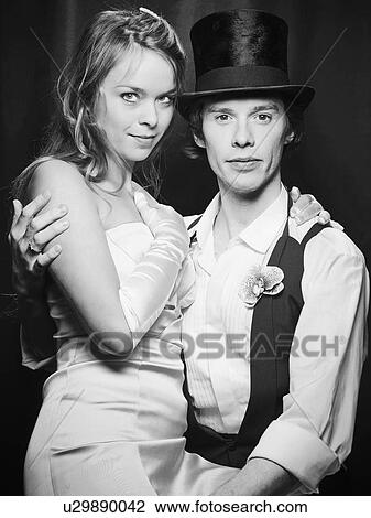 Stock Image - Newlywed couple hugging. Fotosearch
