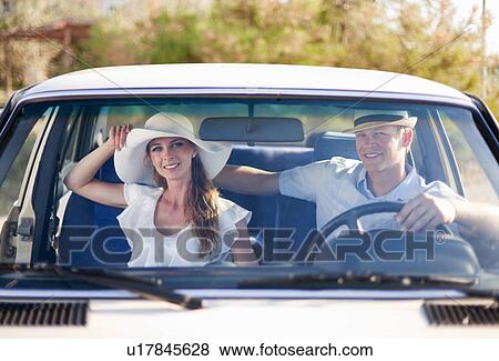 Newlywed couple riding in car View Large Photo Image Stock Photo - Newlywed couple riding in car. Fotosearch
