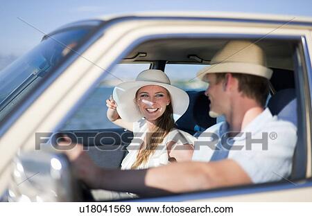 Newlywed couple riding in car View Large Photo Image Stock Photo - Newlywed couple riding in car. Fotosearch