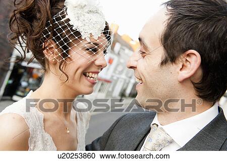 Stock Image - Newlywed couple smiling together. Fotosearch