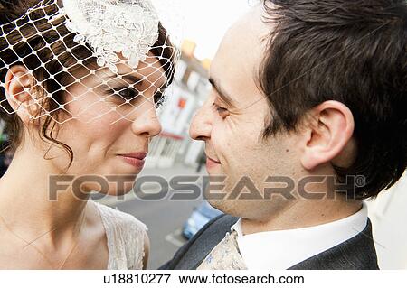 Newlywed couple smiling together View Large Photo Image Stock Photo - Newlywed couple smiling together. Fotosearch