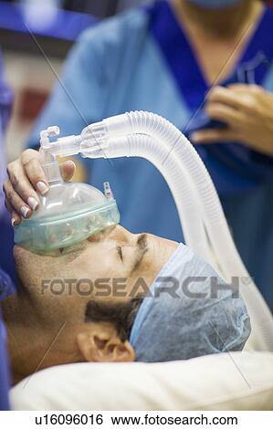 Nurse giving anesthetic gas to patient View Large Photo Image Stock Photograph - Nurse giving anesthetic gas to patient. Fotosearch
