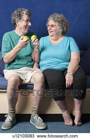 Older couple eating apples together View Large Photo Image Stock Image - Older couple eating apples together. Fotosearch