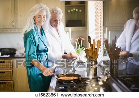 Older couple in bathrobes cooking View Large Photo Image Stock Image - Older couple in bathrobes cooking. Fotosearch
