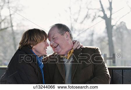 Older couple touching foreheads outdoors View Large Photo Image Stock Photograph - Older couple touching foreheads outdoors. Fotosearch