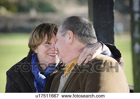 Older couple touching noses outdoors View Large Photo Image Stock Photo - Older couple touching noses outdoors. Fotosearch
