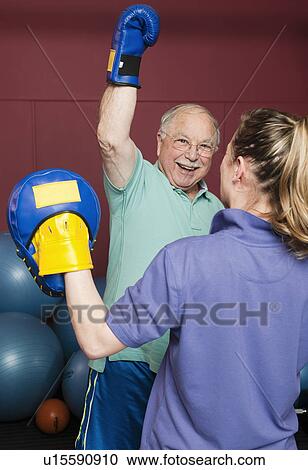 Older man boxing in gym View Large Photo Image Stock Image - Older man boxing in gym. Fotosearch
