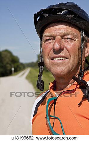 Older man wearing bike helmet View Large Photo Image Stock Image - Older man wearing bike helmet. Fotosearch