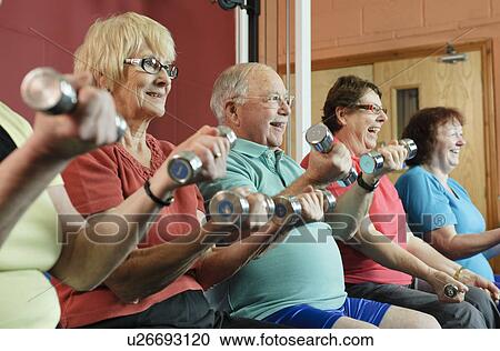 Older people lifting weights in gym View Large Photo Image Stock Image - Older people lifting weights in gym. Fotosearch