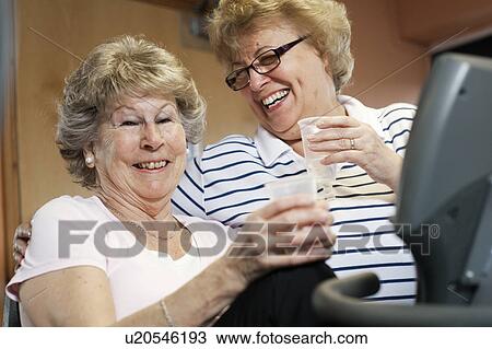 Older women laughing together View Large Photo Image Stock Image - Older women laughing together. Fotosearch
