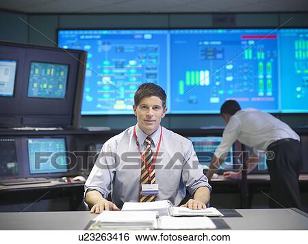 Operator in power station control room View Large Photo Image Stock Photograph - Operator in power station control room. Fotosearch