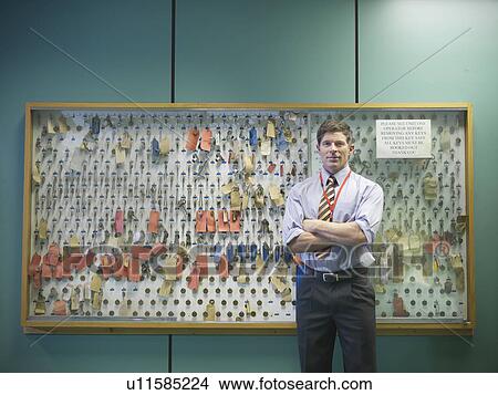 Operator with key store in control room View Large Photo Image Picture - Operator with key store in control room. Fotosearch
