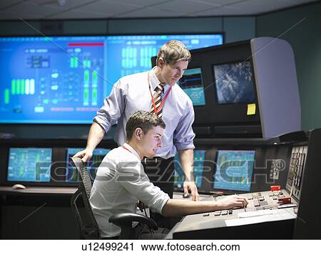 Operators in power station control room View Large Photo Image Stock Image - Operators in power station control room. Fotosearch